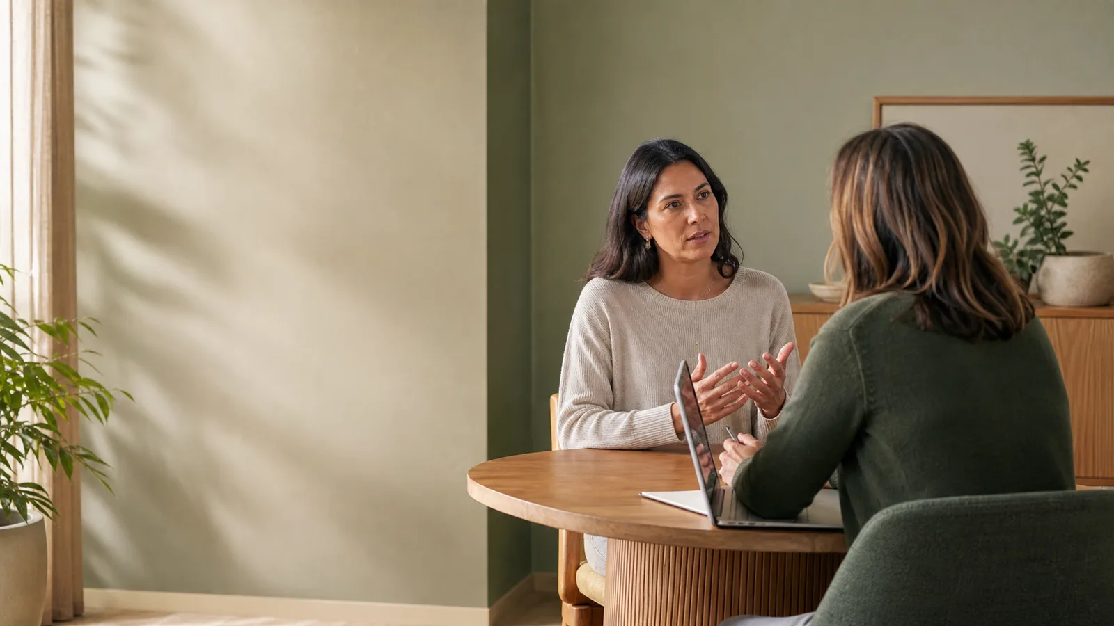 Two people having a private conversation about lived experience.